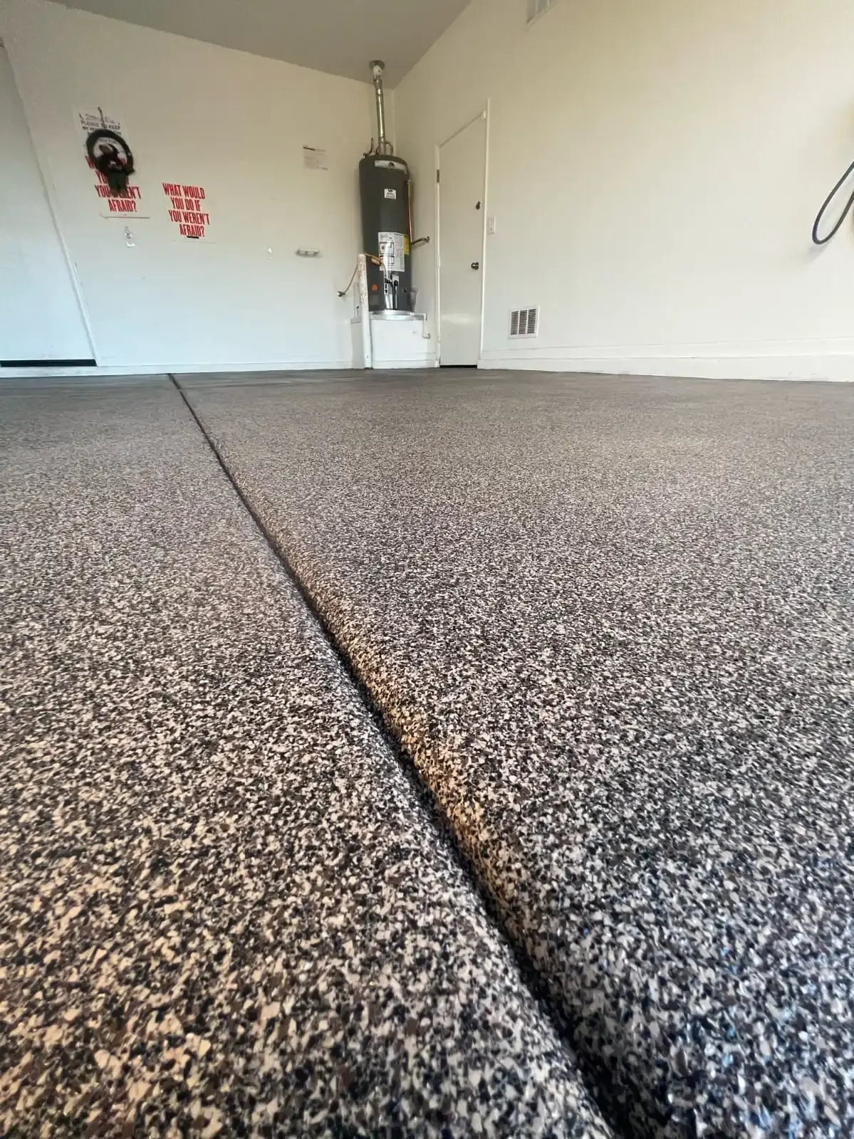 Smooth, textured garage floor surface.